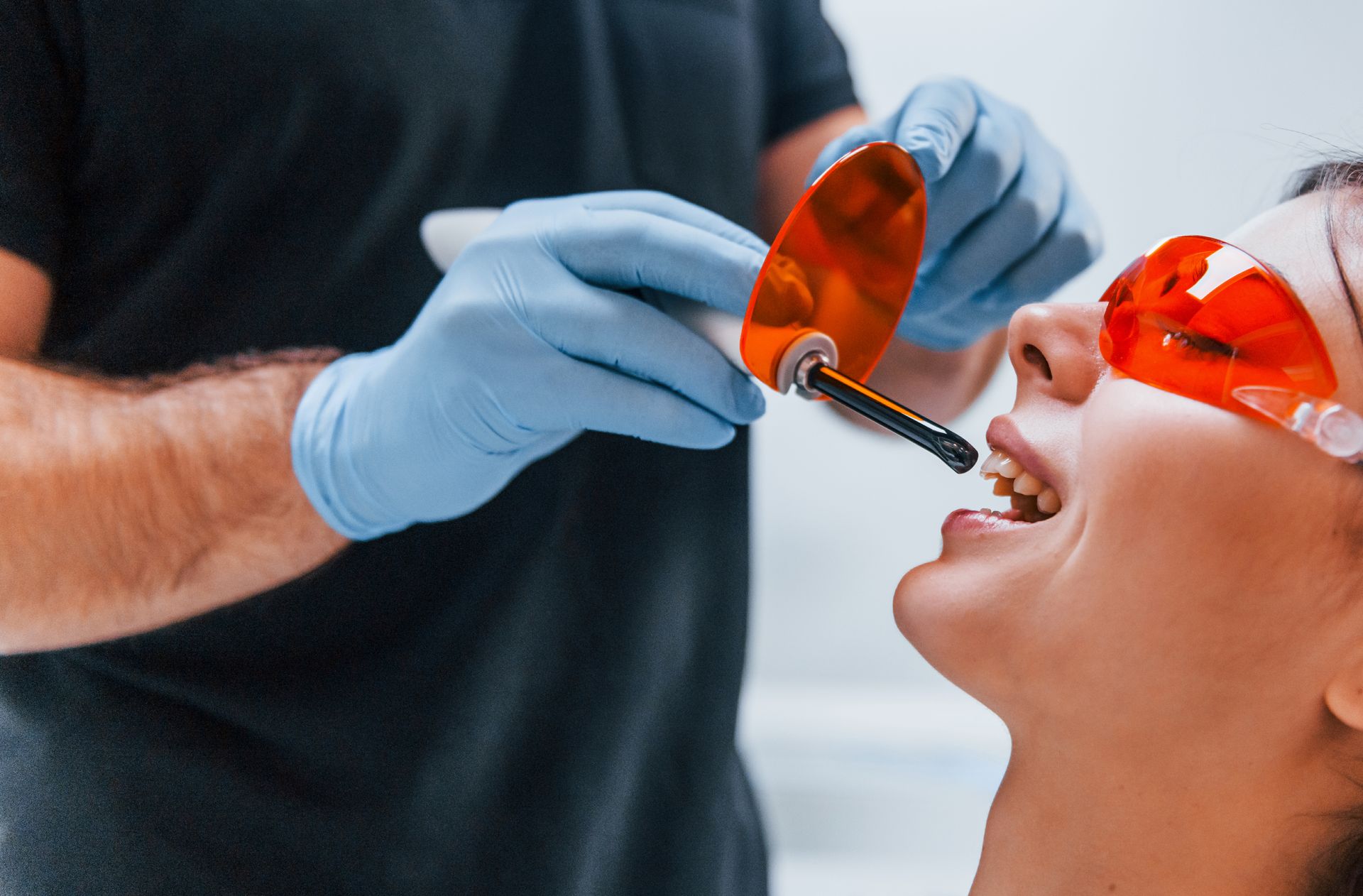 Cosmetic dental bonding that lasts! Woman getting cosmetic dental bonding | Dentist in Somerset NJ | In network with Cigna, Aetna, MetLife