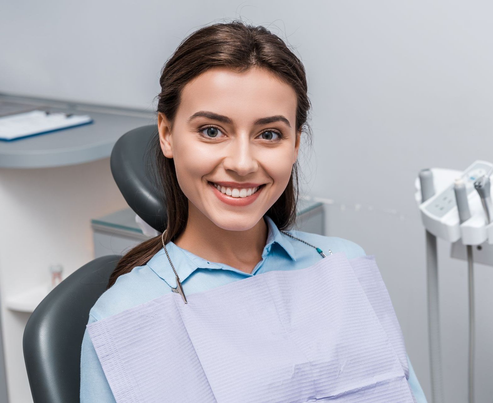 Learn about the benefits of cosmetic veneers, whitening, and Invisalign services in Somerset, NJ. man smiling after getting veneers for a perfect smile | Cosmetic dentist in Somerset, NJ