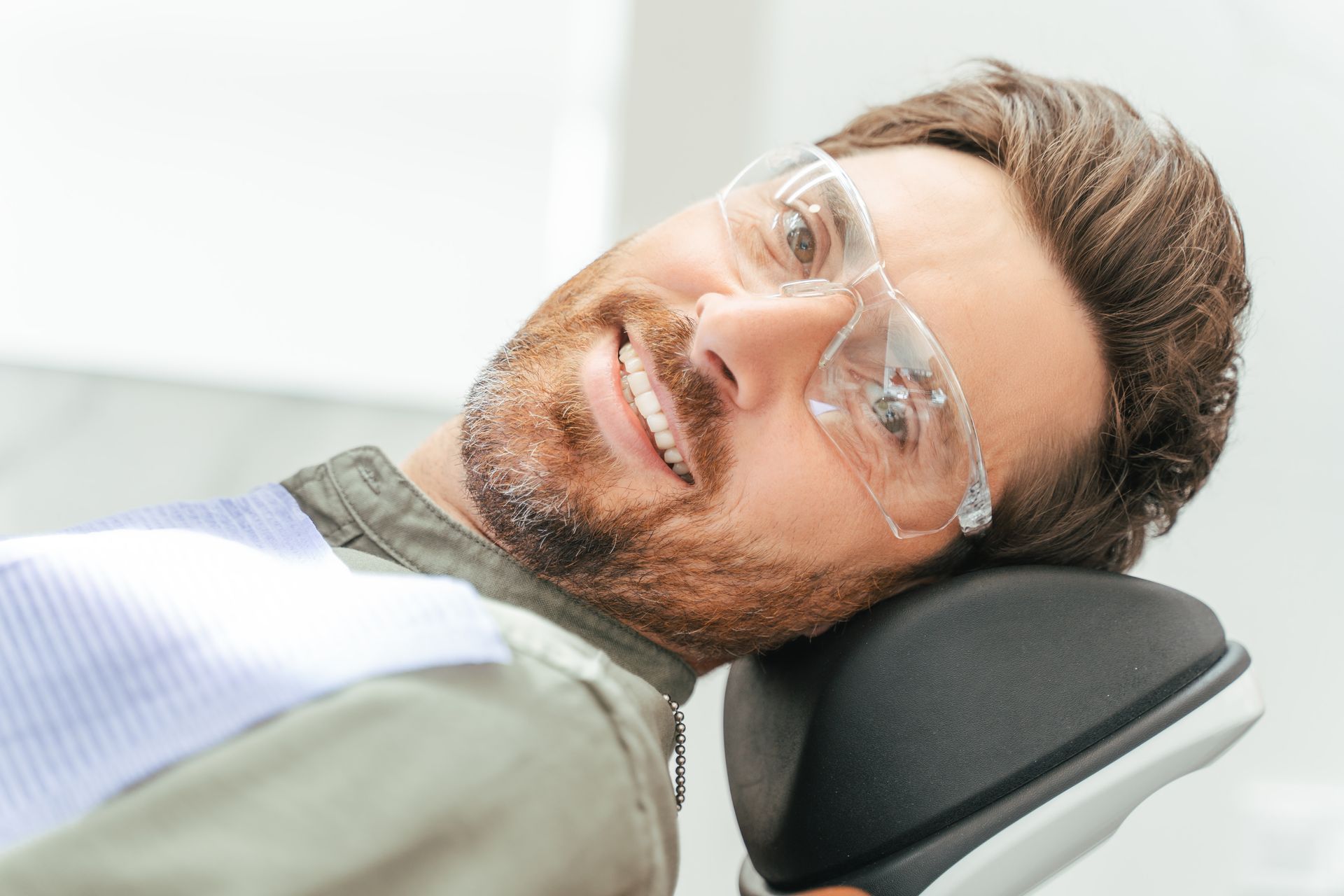Learn about the benefits of ozone therapy for gum disease and pain. Man smiling after hearing the benefits of ozone therapy for gum disease | Somerset NJ Dentist