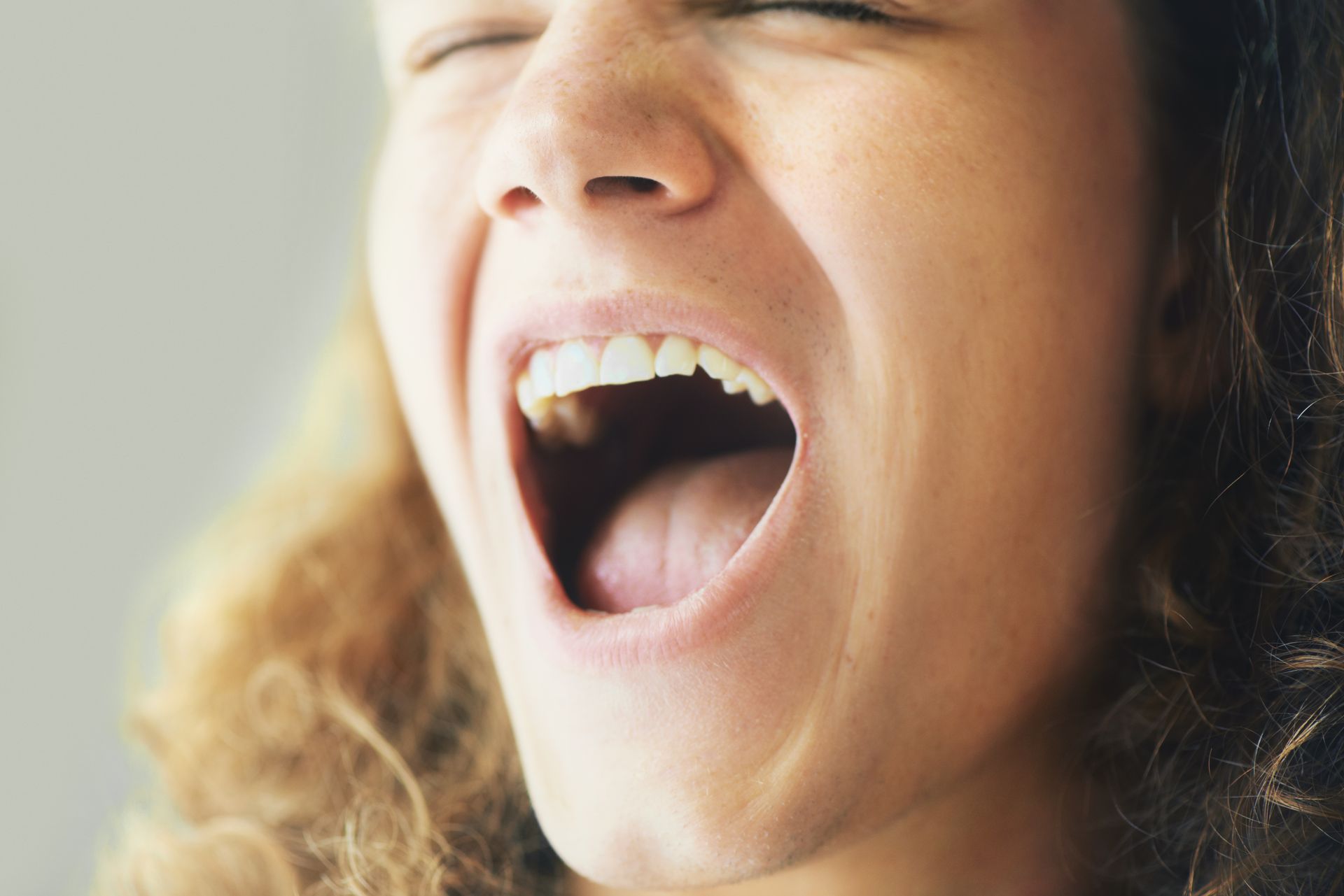 Understand your oral microbiome with testing from our biological dentist in Somerset, NJ. woman with mouth open | oral microbiome testing | Biological dentist Somerset NJ
