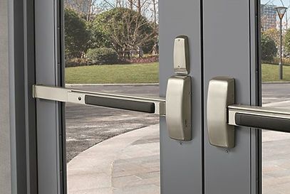 A close up of a door with a panic bar on it.