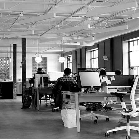 a group of people working in an office