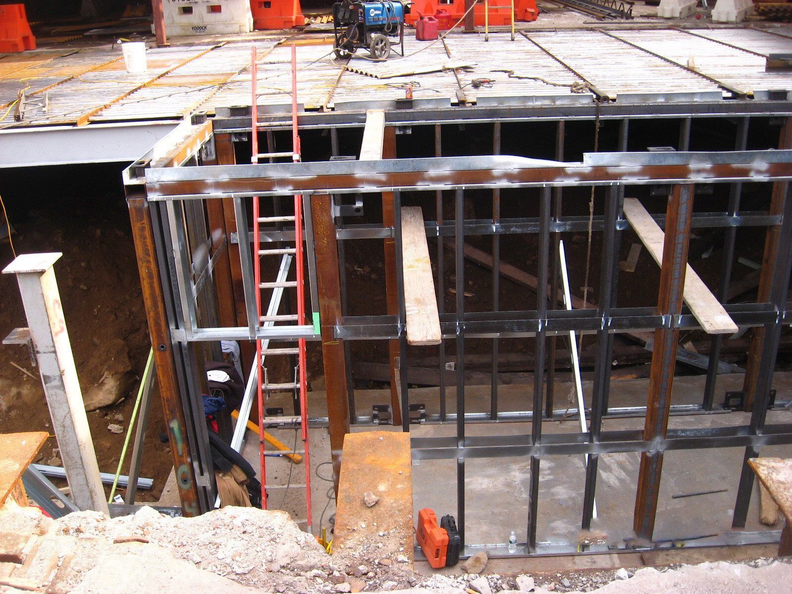 A construction site with a ladder in the foreground