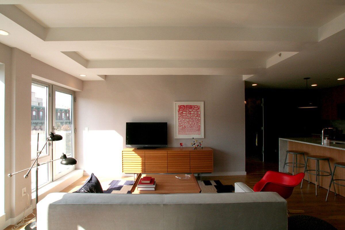 A living room with a couch and a flat screen tv