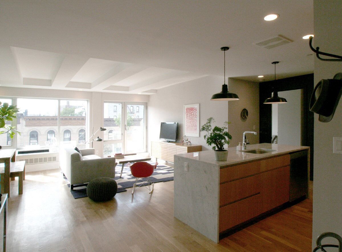 A living room with a large island in the middle