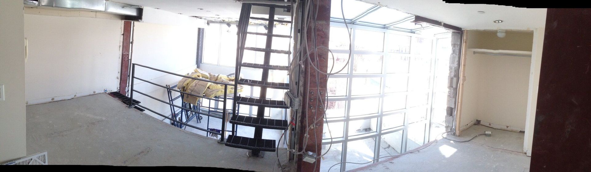 There is a spiral staircase in the middle of the room.