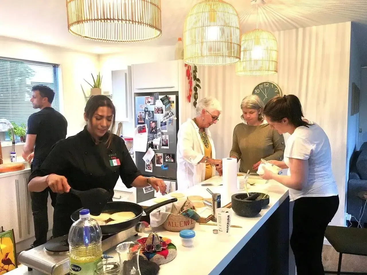 A group of people are preparing food in a kitchen.