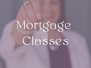 a woman is holding a house key in her hand .