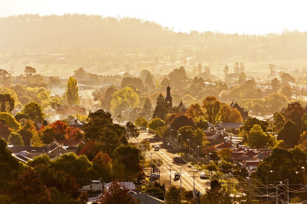 An Aerial View of a City at Sunset — R.P's Total Assessments & Driver Training Pty Ltd In Glen Innes, NSW