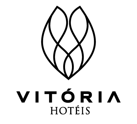 Vitória Hotéis logo in black with stylized floral emblem on white background