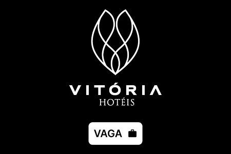 Vitória Hotéis logo on black background with “VAGA” vacancy button icon