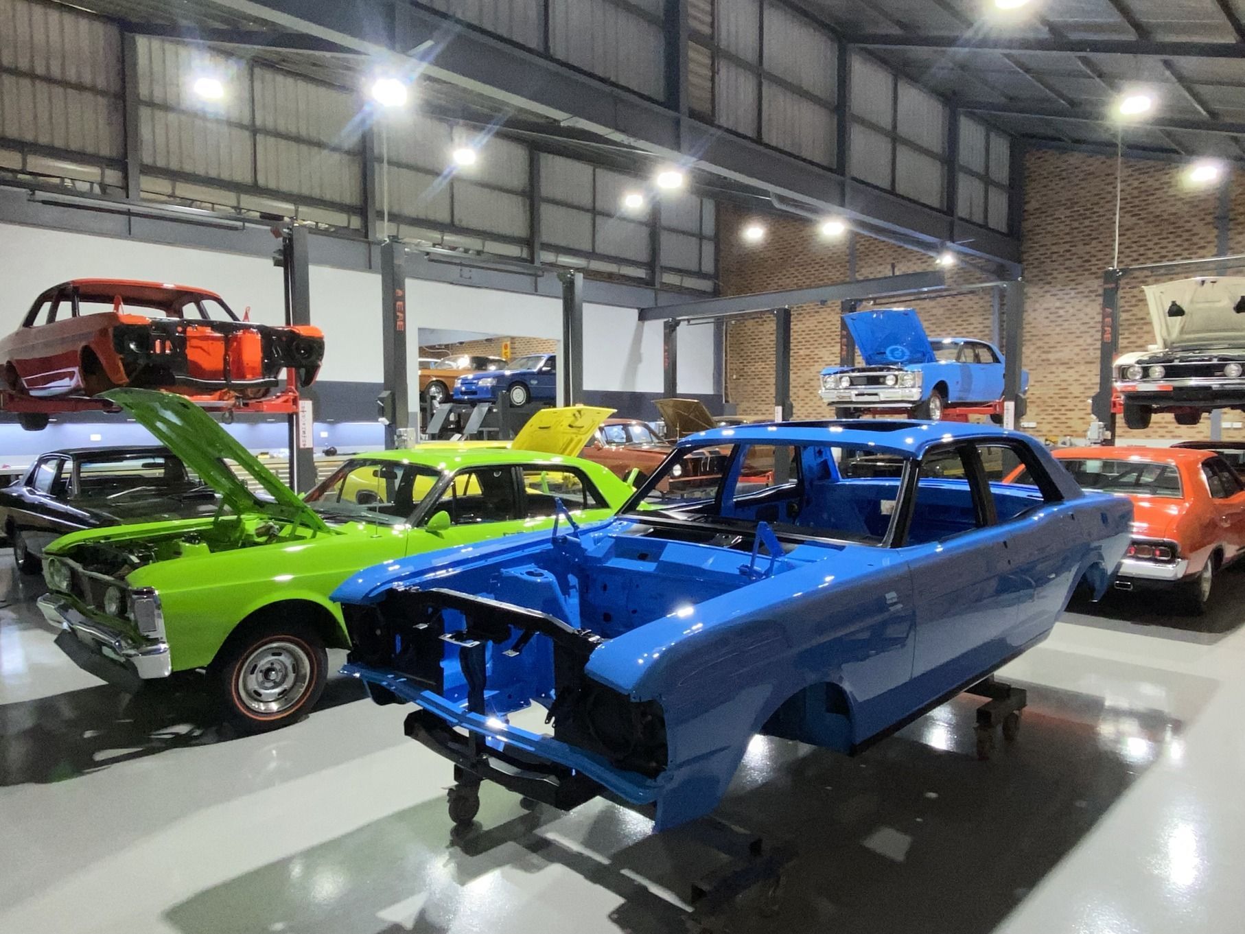 Front of Red Car with Two Headlights — We Restore & Produce Falcon GT Replicas in Sydney, NSW