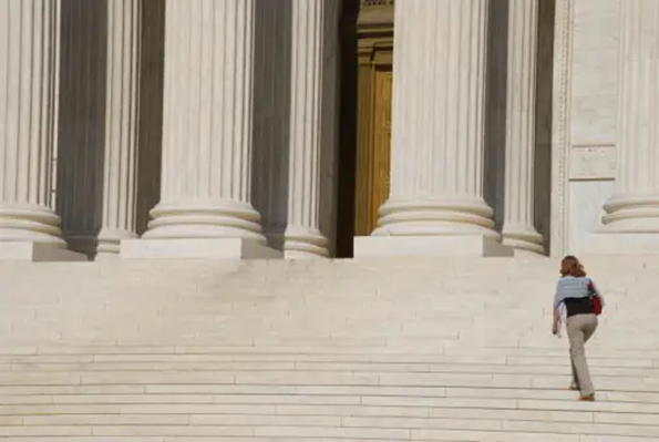 Lawyer walking up the steps to the court room