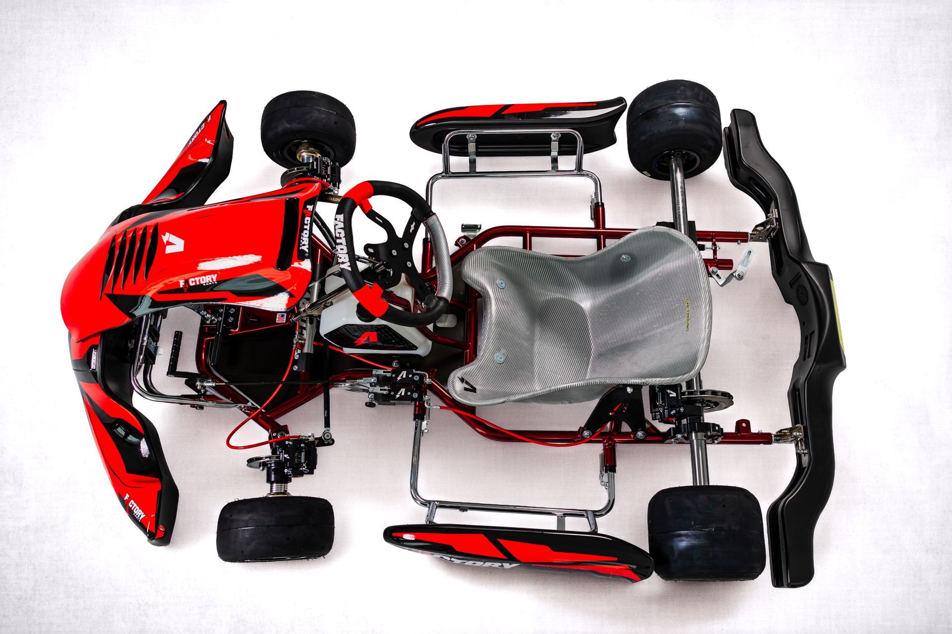 Red and black Factory Karts DD2 Chassis photographed from the front on a white background