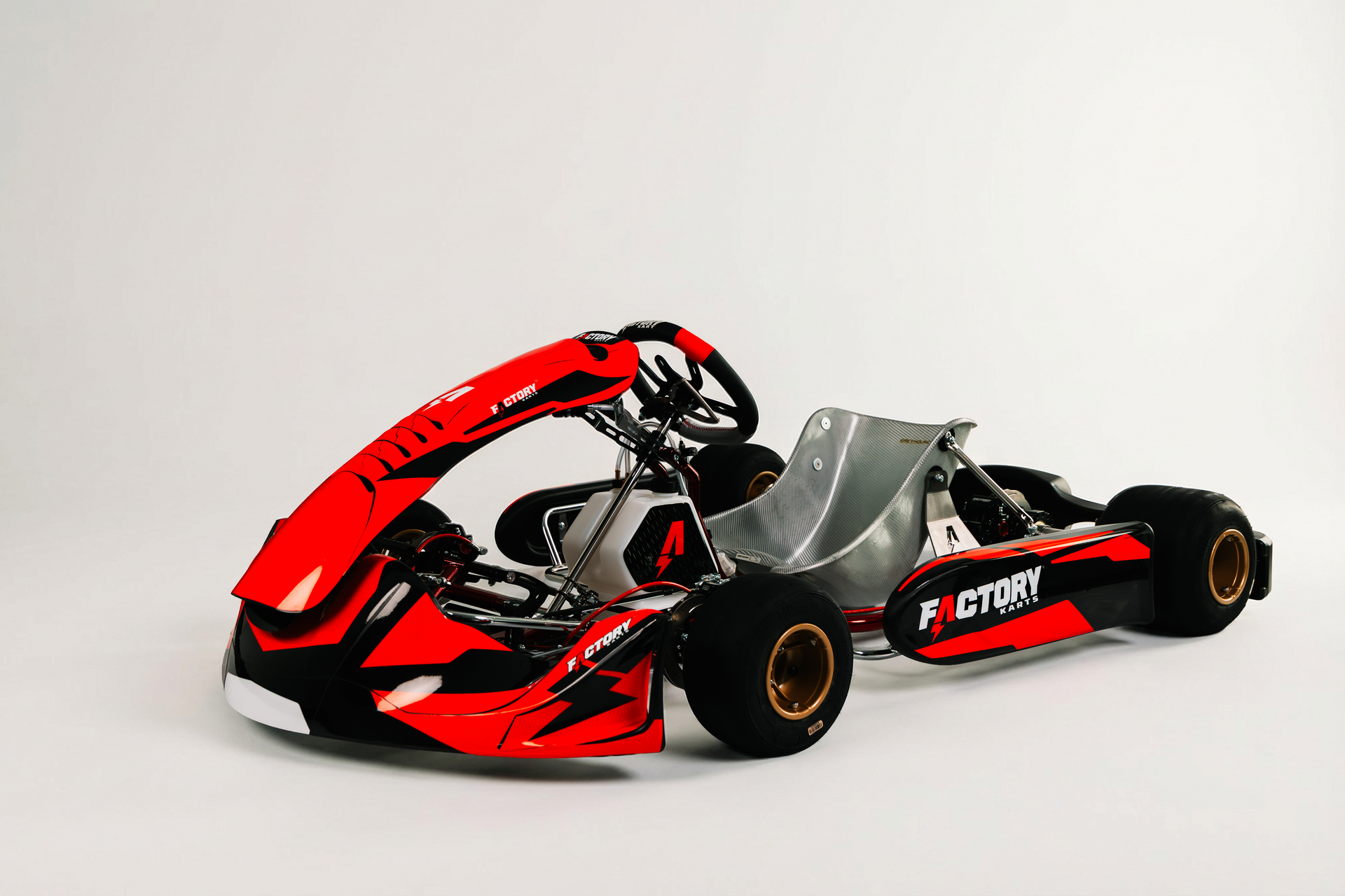 Red and black go-kart with large rear spoiler on a white background