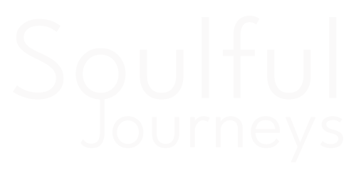 Faint white “Soulful Journeys” text on a white background
