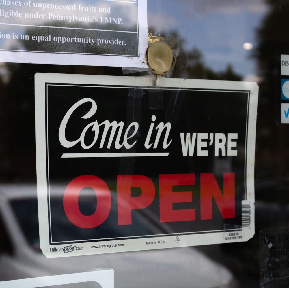 A sign that says come in we 're open