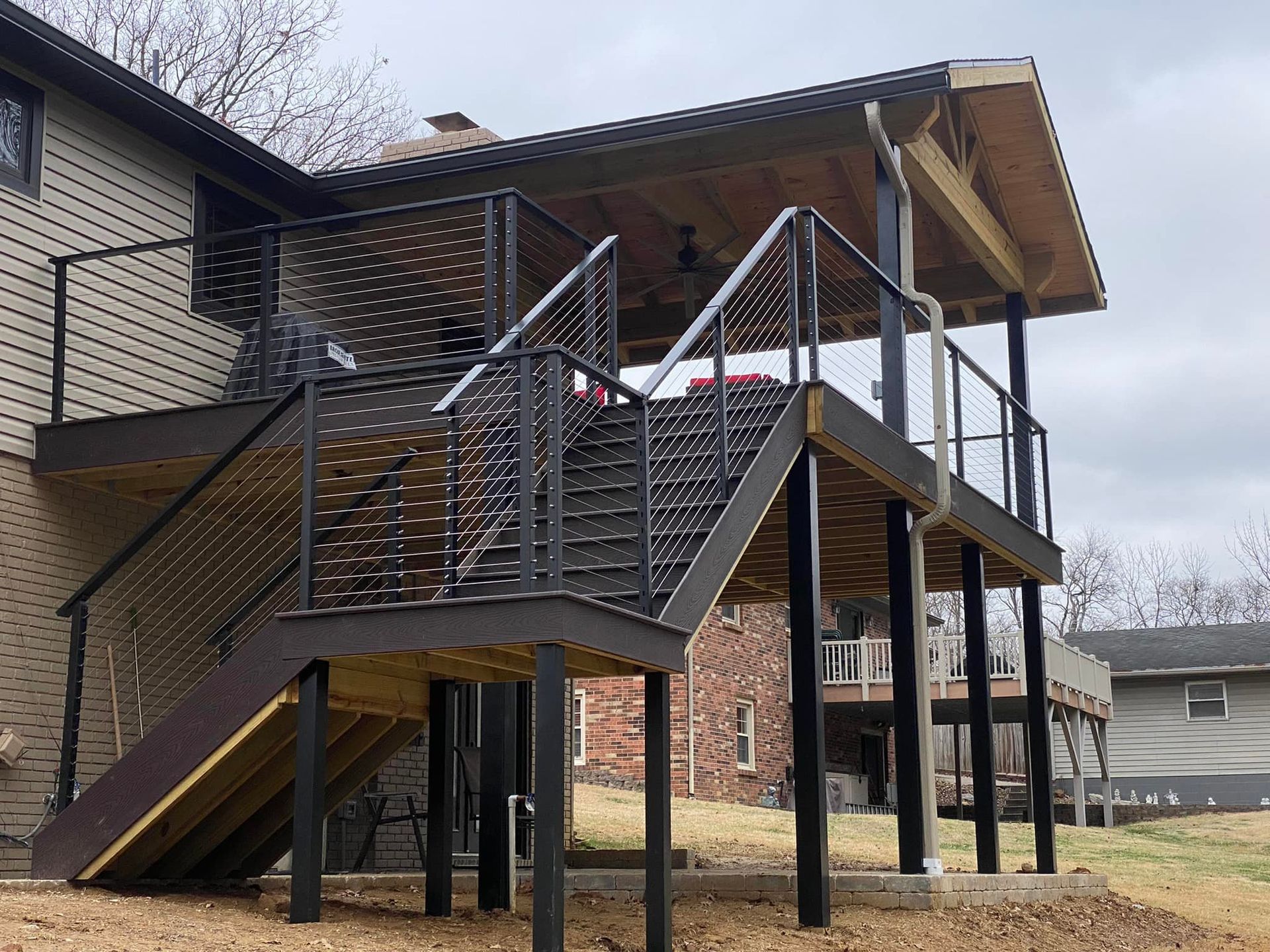 A wooden deck with stairs leading up to it