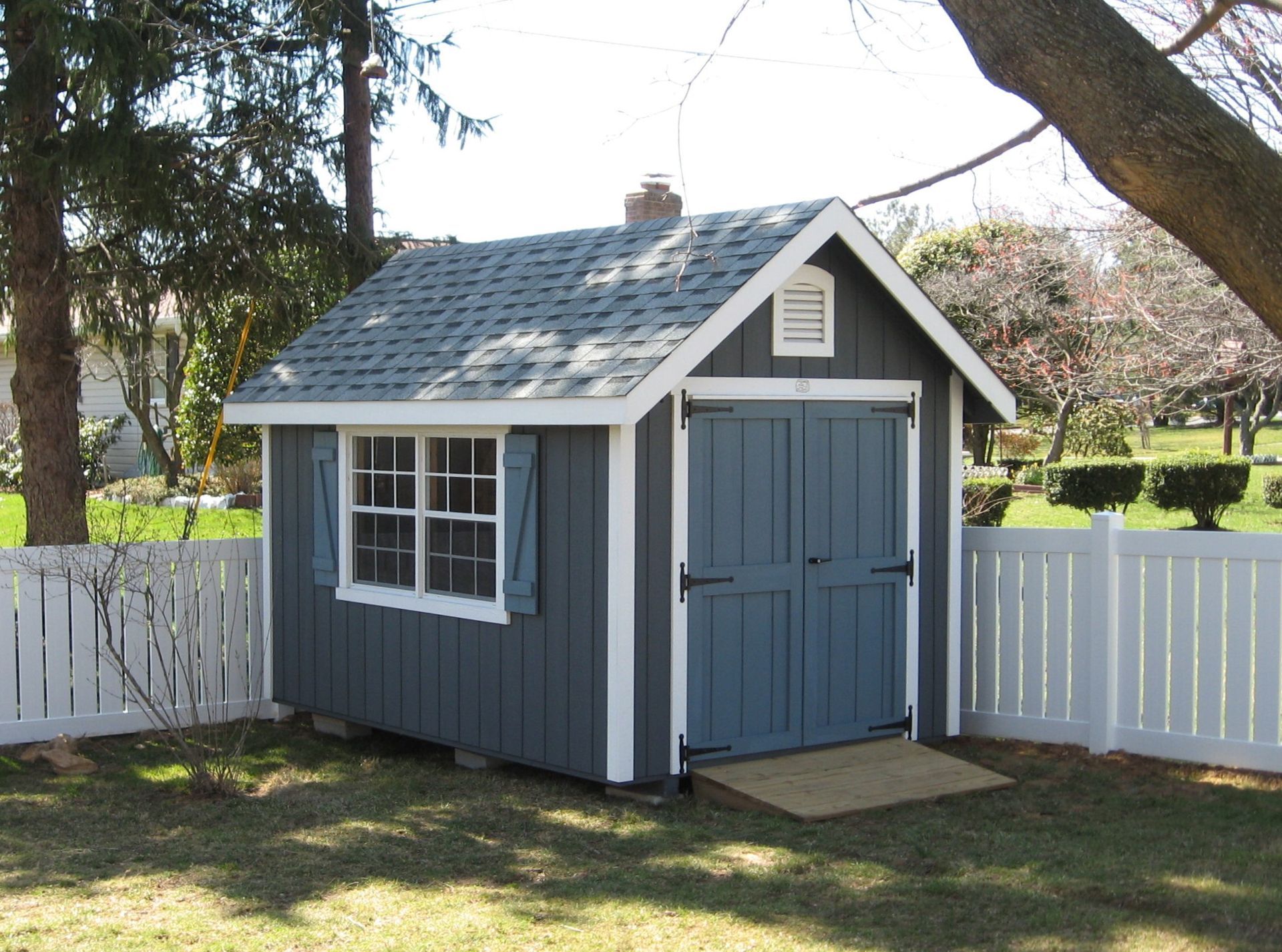 garden shed with blue siding 