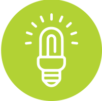 White glowing lightbulb on a green background.