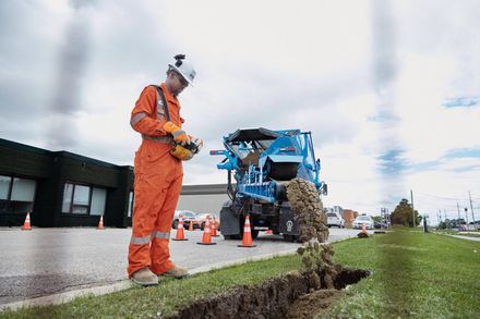 Employee using stone slinger