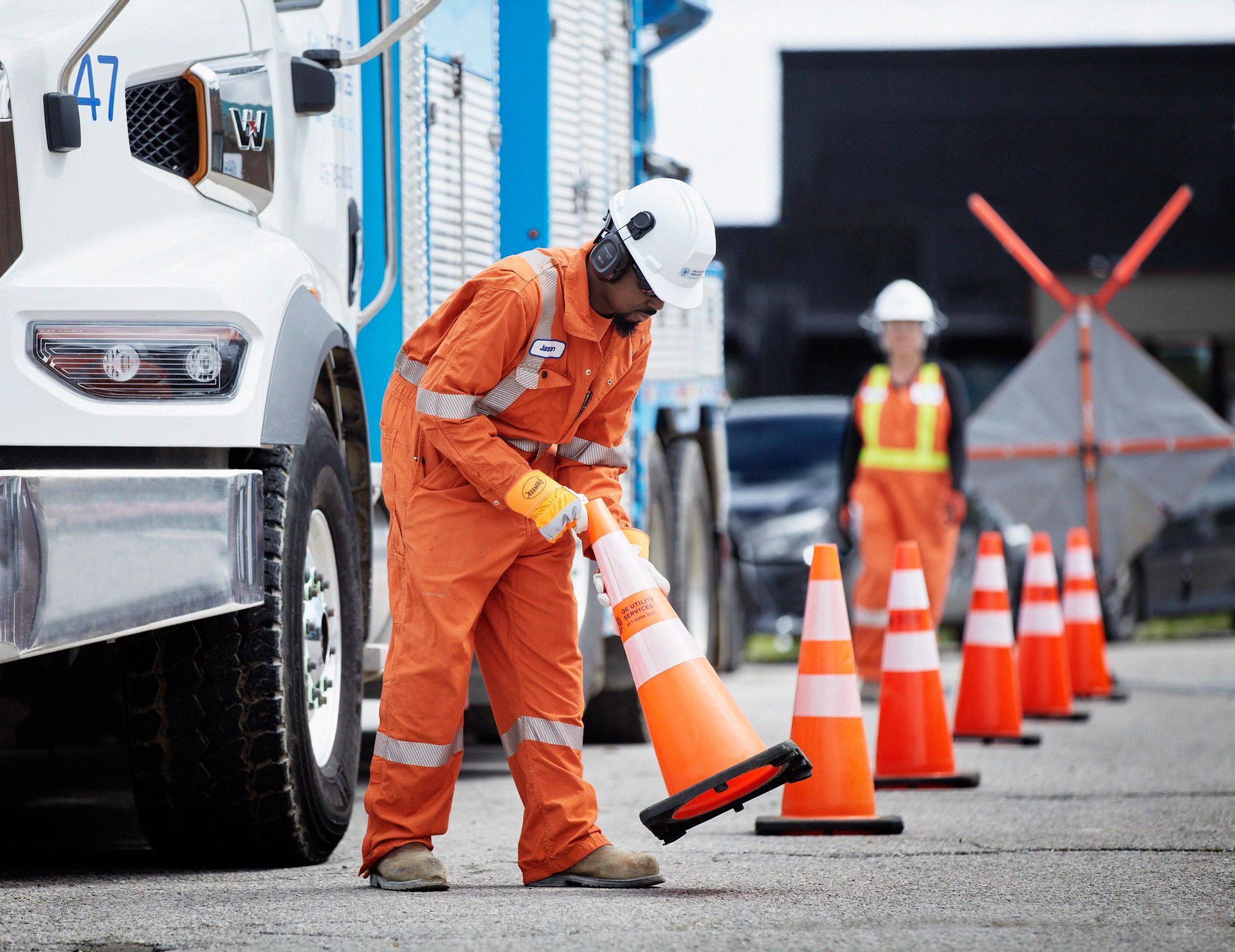 OE employee setting up safety cones