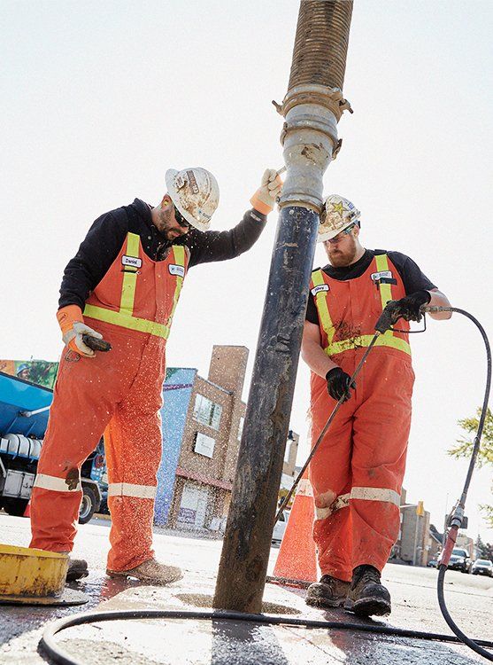Workers on site doing subsurface utility engineering