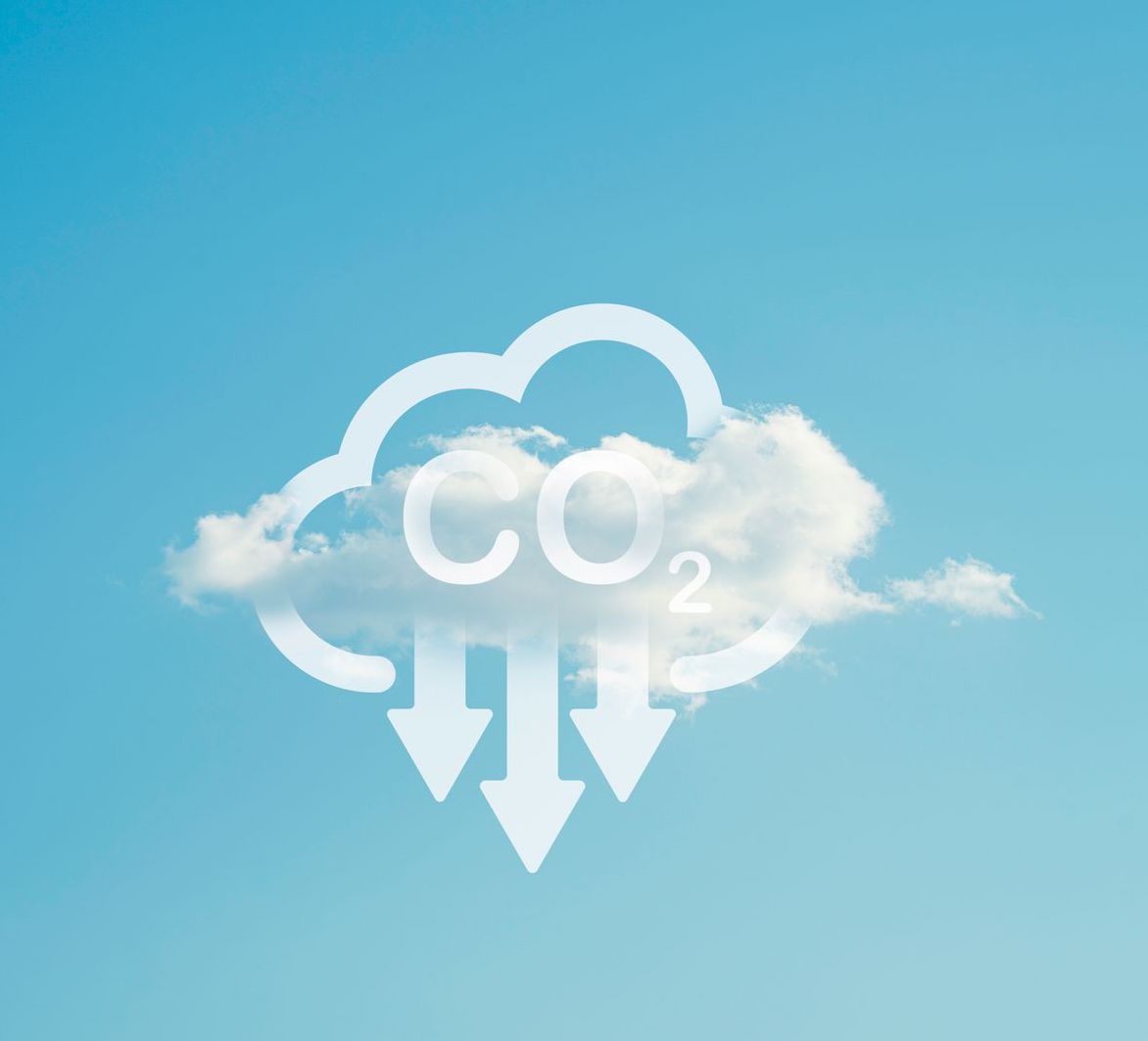Image of cloud with CO2 text and arrows pointing down

