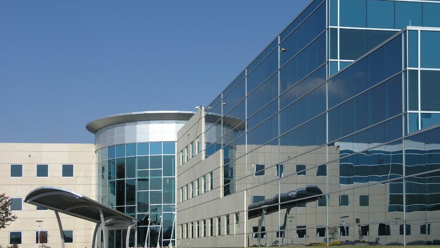 A large building with a lot of windows and a canopy