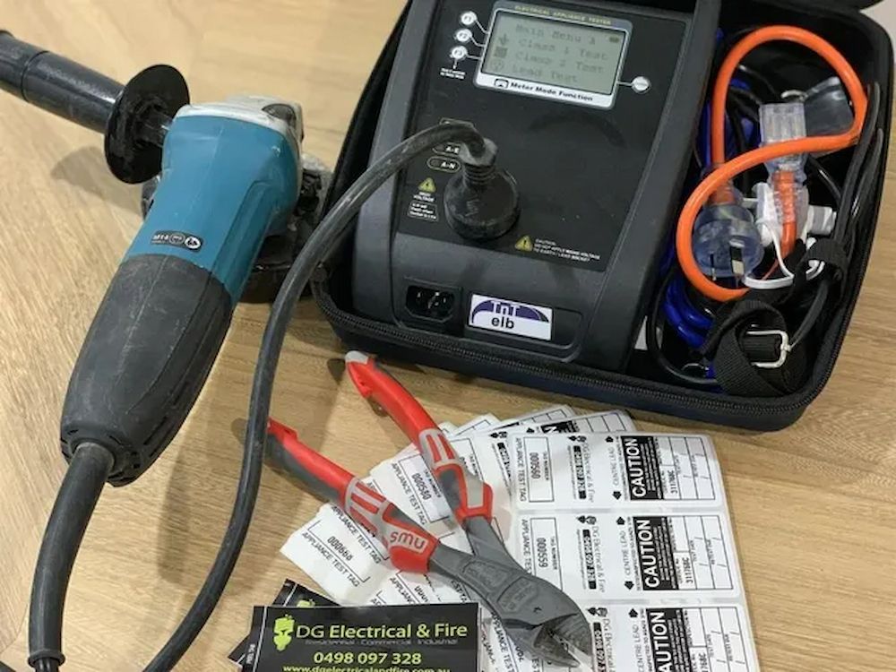 An Electrician Is Using A Multimeter To Test A Circuit Board — DG Electrical & Fire In Gerringong, NSW