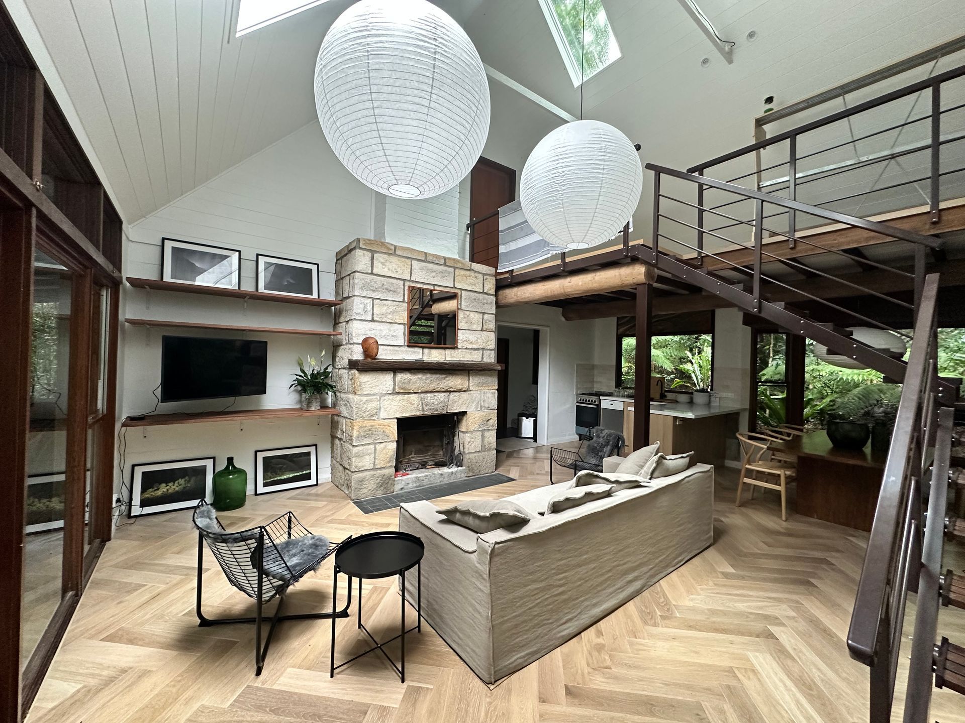 Living Room With Stone Fireplace, Loft, and Large White Globe Lights — DG Electrical & Fire In Kiama, NSW
