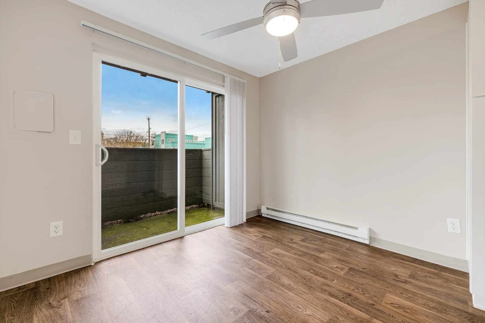 Photo of the patio seen from the living room, with plenty of natural light coming through the window
