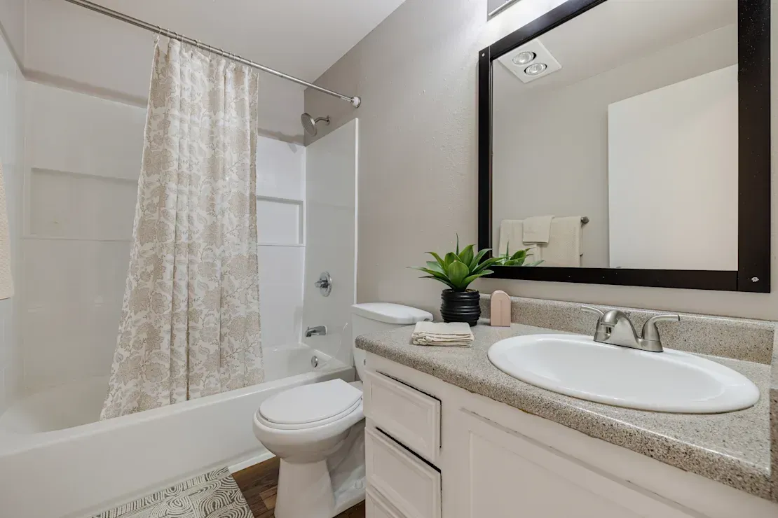 Photo of a bathroom with a shower/tub combo