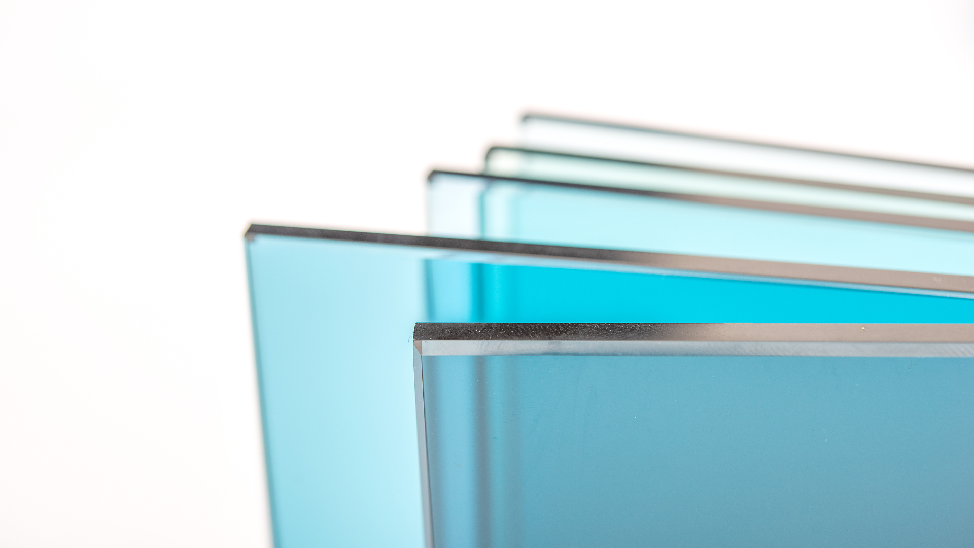 A stack of blue glass sheets on a white background.
