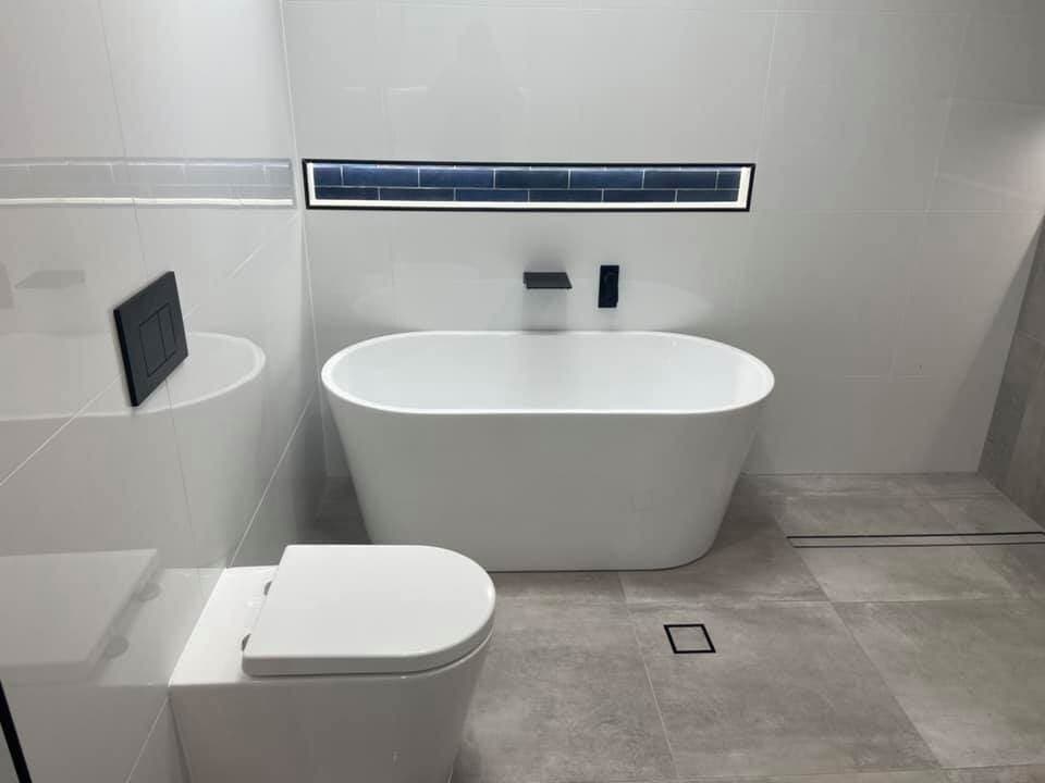 White Bathtub And Toilet — Rossi Plumbing in Gold Coast, QLD