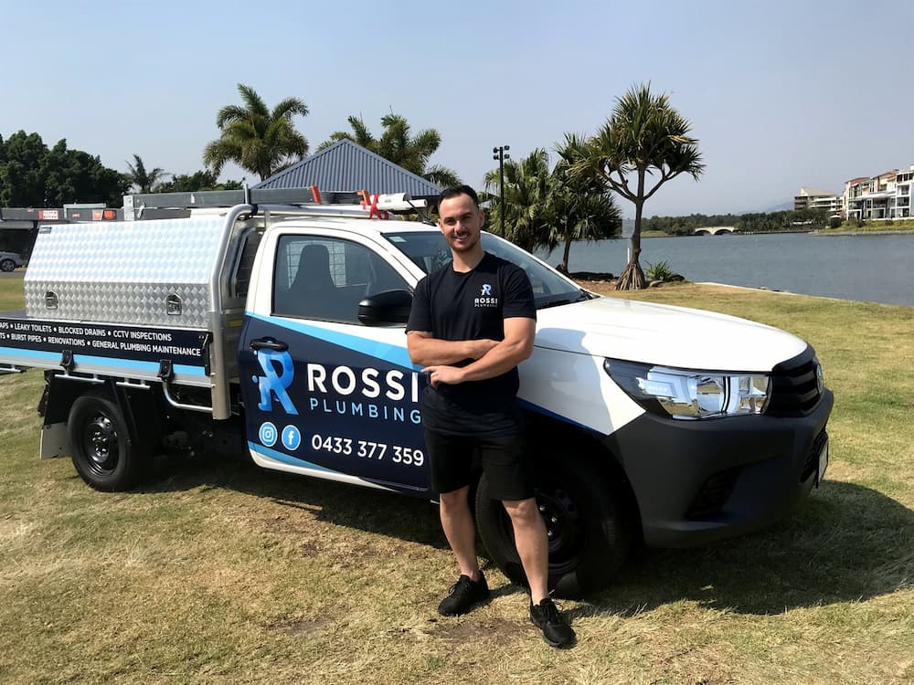 Plumber with the Rossi Plumbing Company Vehicle — Rossi Plumbing in Gold Coast, QLD