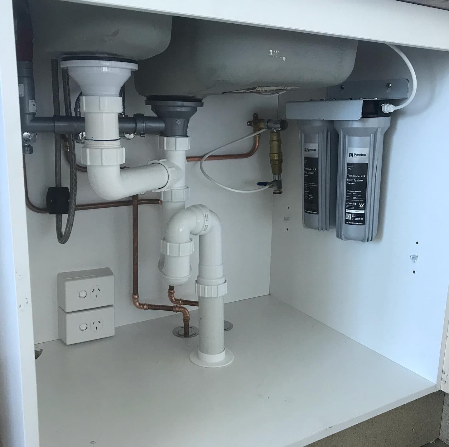 Newly Installed Kitchen Sink Drain Pipes — Rossi Plumbing in Gold Coast, QLD