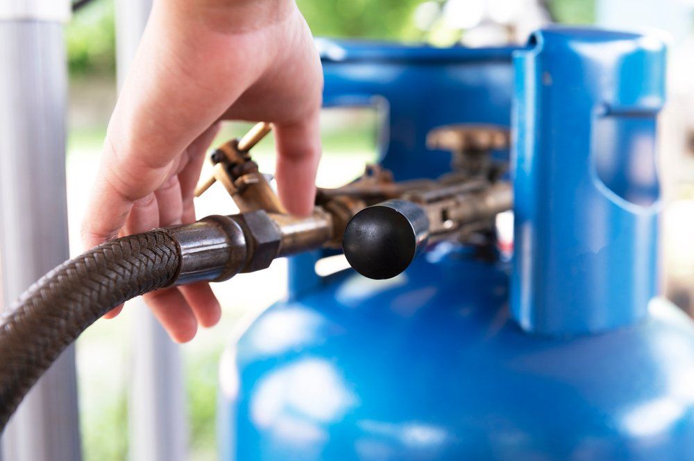 Bunch of LPG Gas Cylinders — Fletcher's Plumbing & Gas Fitting Pty Ltd in Katherine, NT