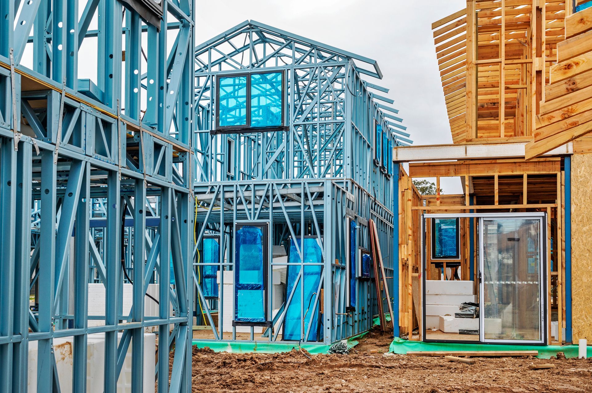 A house is being built with a lot of metal and wood.