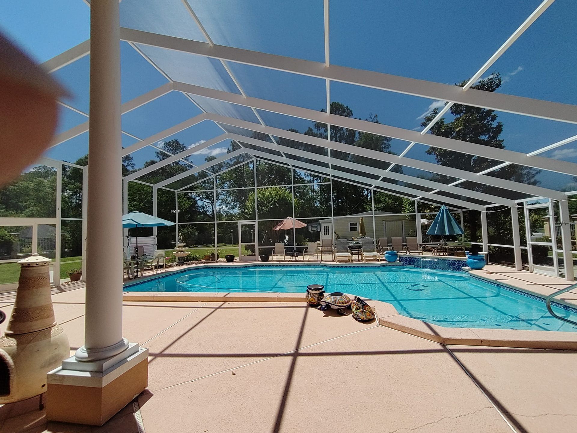 A large swimming pool with a clear roof