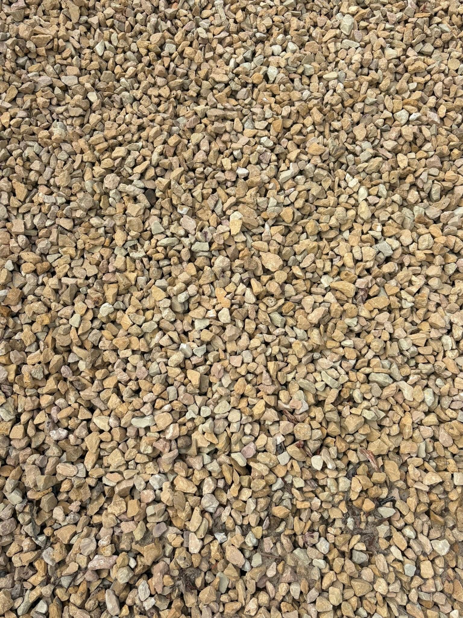 Close-up of small tan and brown gravel stones covering the ground