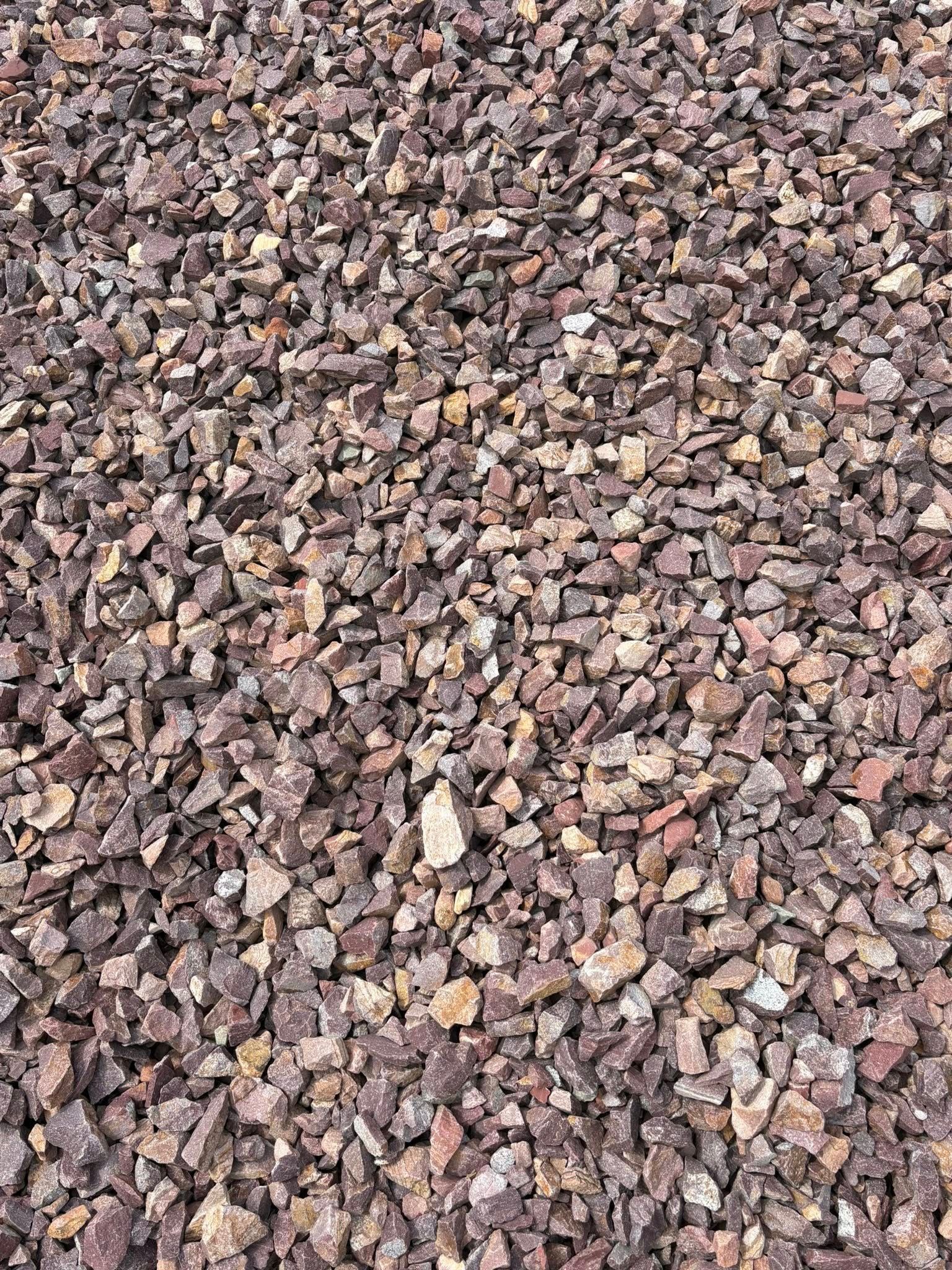 Close-up of small multicolored gravel stones filling the frame.