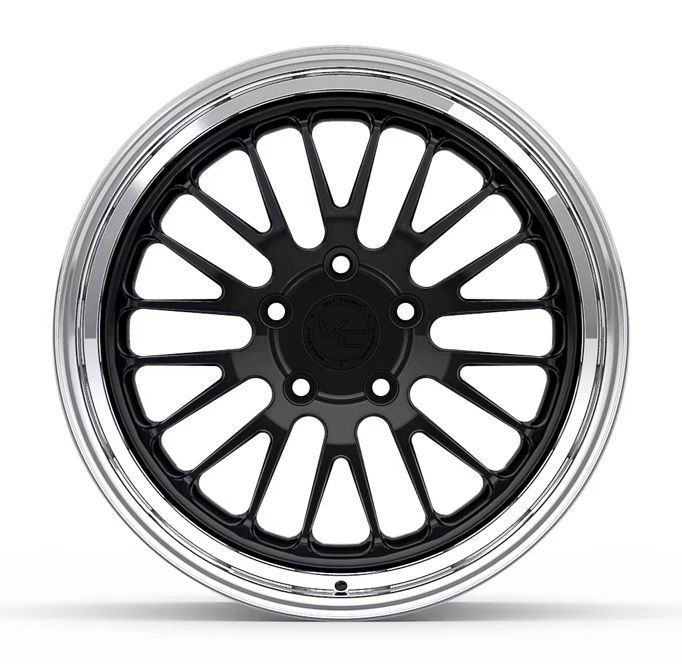 Black multi-spoke car wheel rim with a polished silver outer edge on a white background