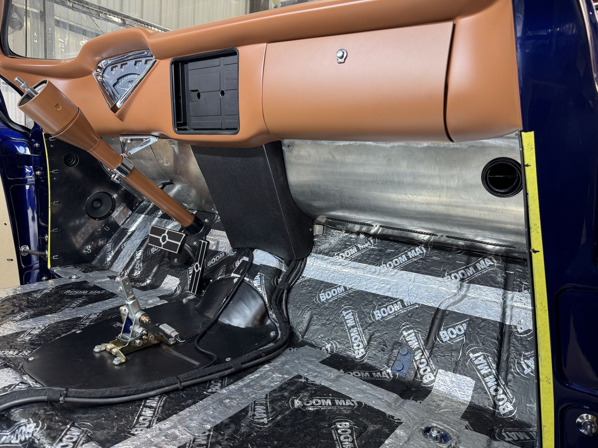 Damaged car interior with deployed airbags, torn dashboard, and shattered windshield debris