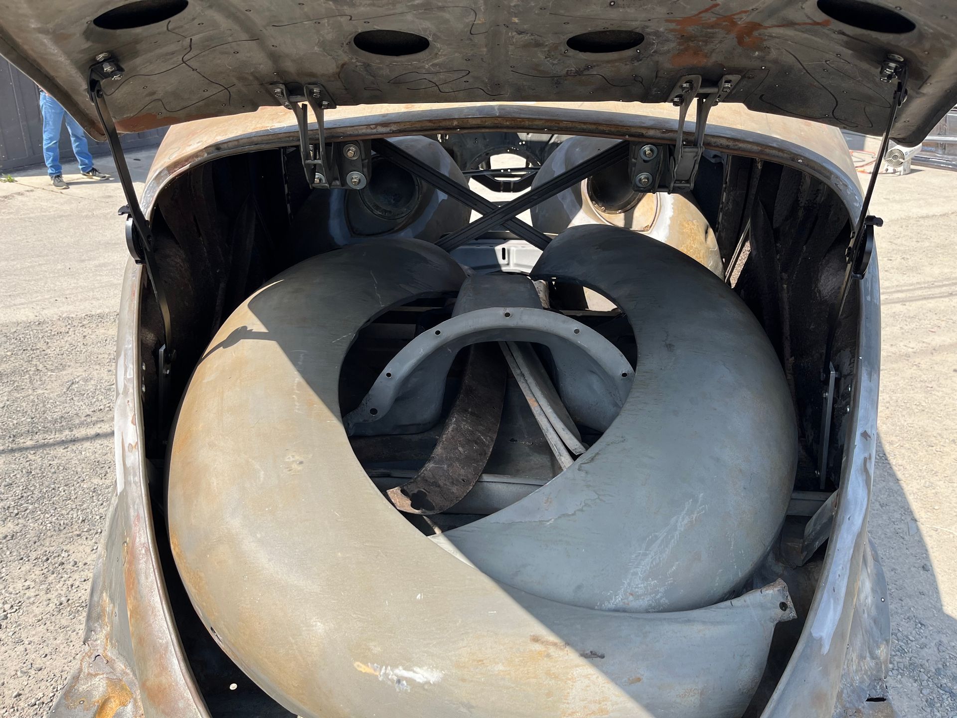 Two large industrial fans inside a metal housing, viewed from above.