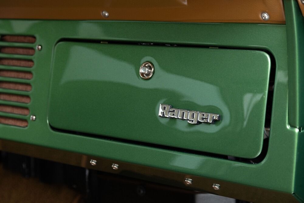 Close-up of a green metal cabinet door with a chrome lock and “Hangar” label
