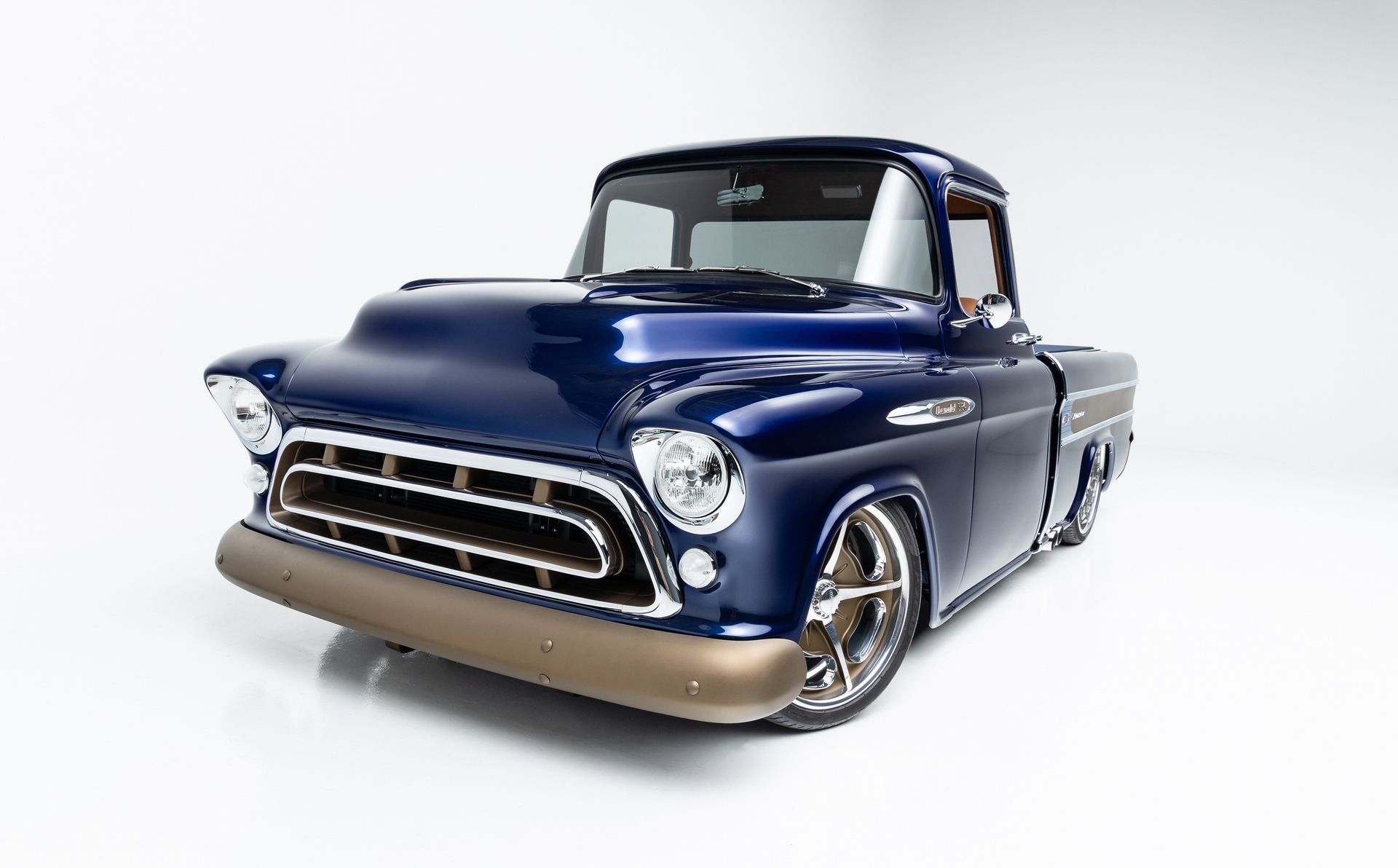 Classic blue vintage pickup truck on a white studio background