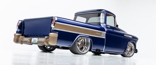 Blue classic lowrider pickup truck with chrome details, side view on a white background