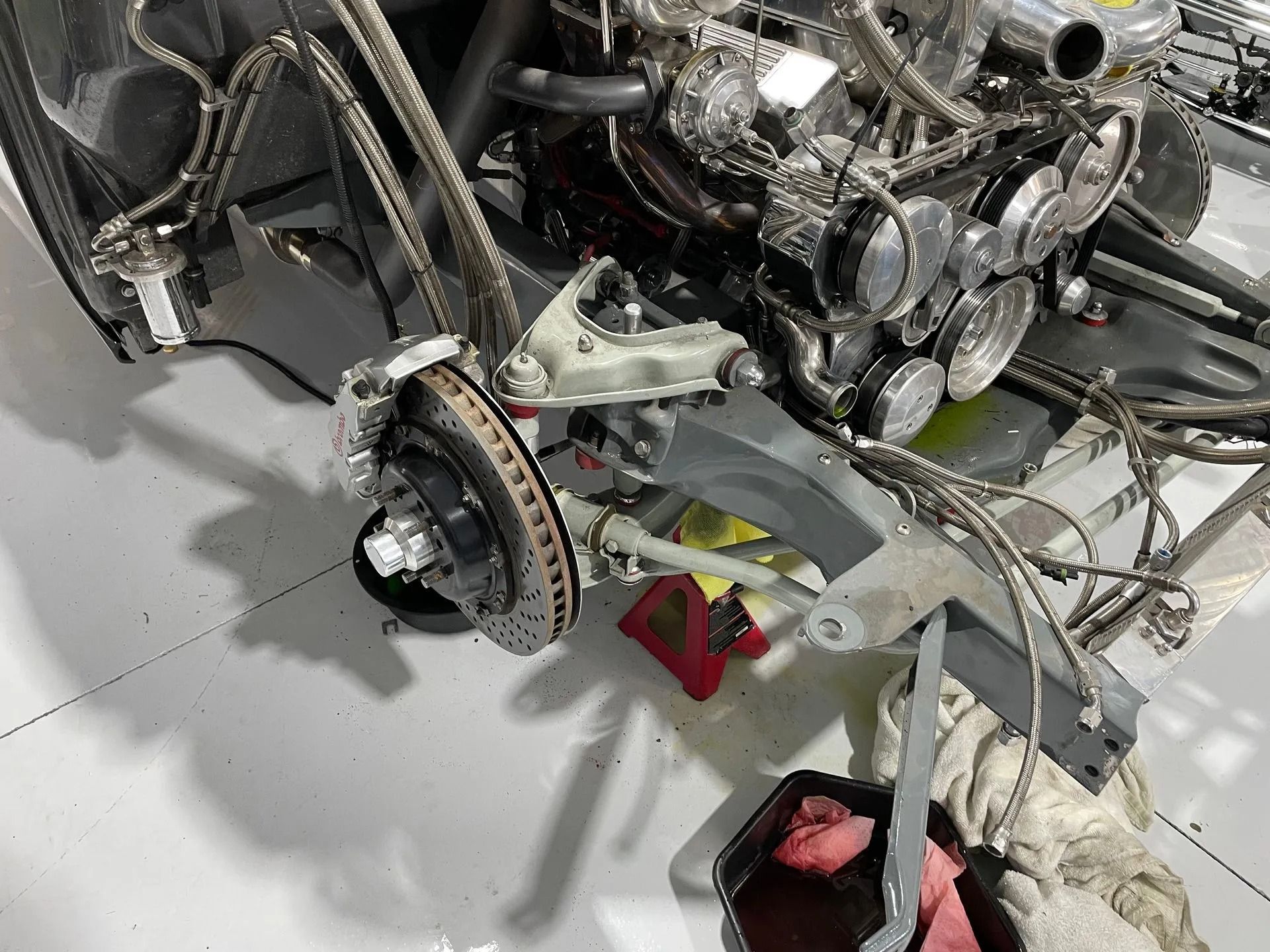 Airplane landing gear and exposed engine components in a maintenance hangar