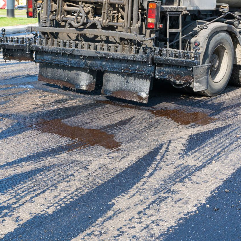 Professional asphalt sealcoating crew in San Antonio